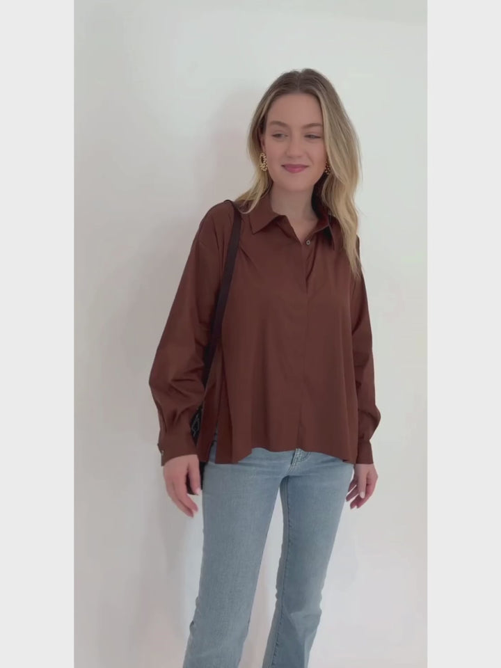 Repeat Blouse With Side End Slits in Brown paired with Frame LeEasy Flare Raw Fray Jeans, and Sol and Selene Divide & Conquer Woven Crossbody Bag in Chocolate